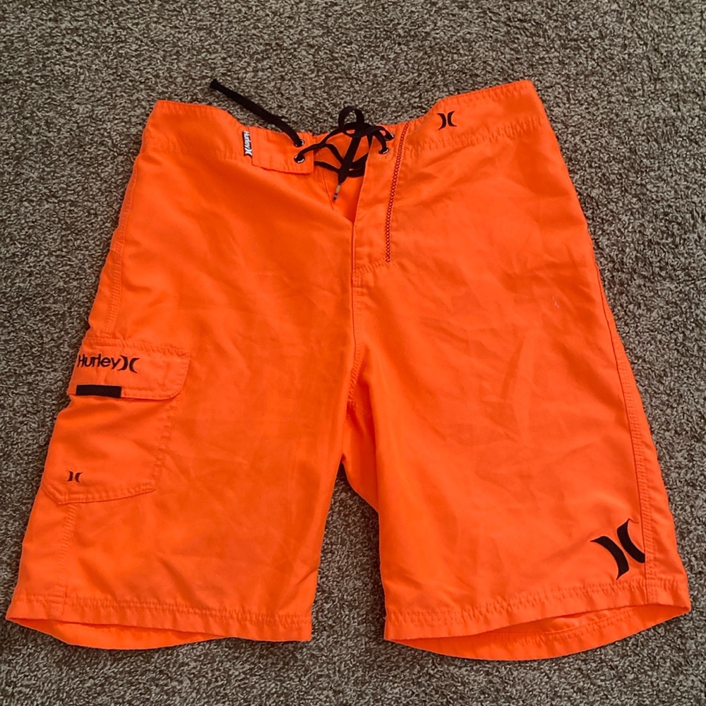 Neon orange Hurley board shorts/swim trunks for men. Size 32.